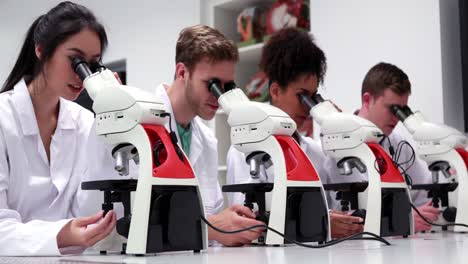 Medical-students-working-with-microscopes
