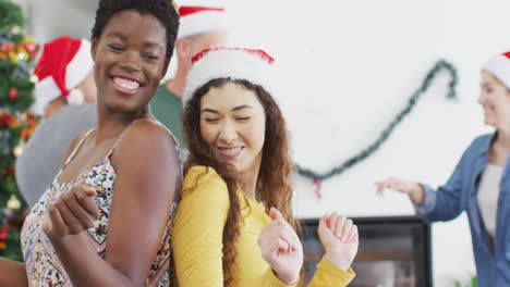 Happy-group-of-diverse-friends-dencing-at-christmas-party