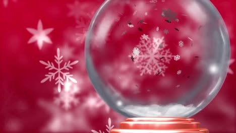 Animation-Der-Weihnachtsschneekugel-Mit-Schnee,-Der-Auf-Roten-Hintergrund-Fällt