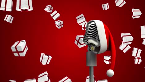 Animation-of-falling-gifts-over-microphone-on-red-background