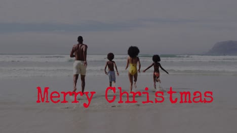 Animation-Von-Weihnachtsgrüßen-über-Eine-Afroamerikanische-Familie-Am-Strand