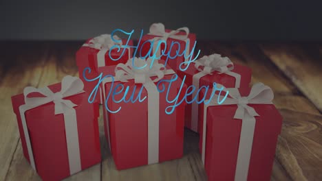 Animation-of-new-year-greetings-text-over-red-christmas-presents