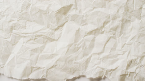 Video-of-close-up-of-crumpled-white-paper-texture-background