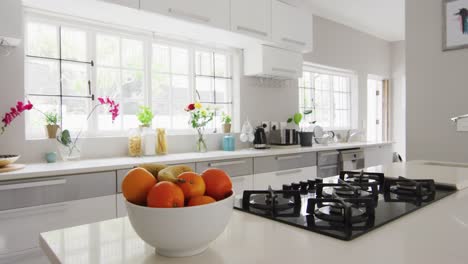 Video-of-bowl-of-oranges-in-modern-and-bright-kitchen