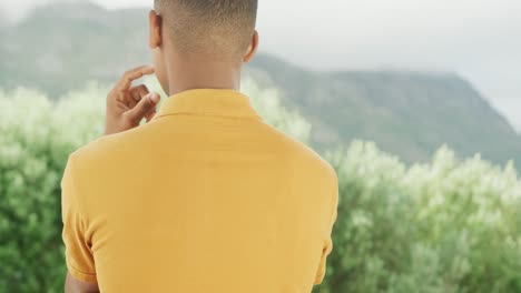 Slow-motion-video-of-african-american-man-wearing-yellow-polo-shirt-with-copy-space