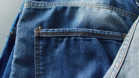 Close-up-of-jeans-with-different-shades-with-copy-space