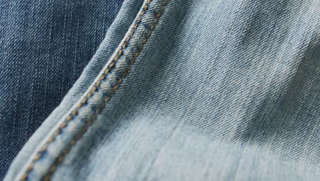 Close-up-of-jeans-with-different-shades-with-copy-space