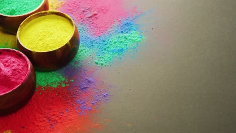 Video-of-multi-coloured-powders-and-bowls-with-copy-space-on-black-background