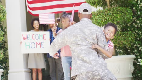African-american-male-soldier-returning-home,-greeted-by-happy-children-and-family,-slow-motion