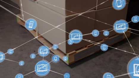 Animation-of-network-of-digital-icons-over-stack-of-boxes-on-a-pallet