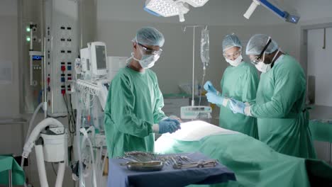 Serious-diverse-surgeons-with-face-masks-preparing-surgery-in-operating-room-in-slow-motion