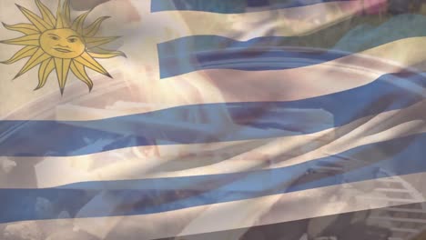 Animation-of-uruguay-flag-waving-over-firewood-burning-on-barbecue-grill