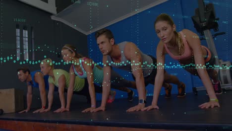 Animation-of-data-processing-over-group-of-diverse-fit-people-performing-plank-exercise-at-the-gym