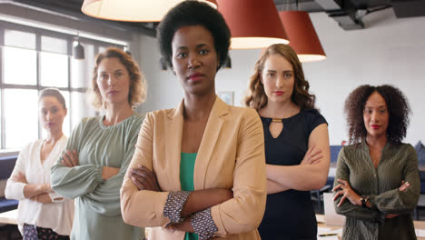 Portrait-of-confident-diverse-businesswomen-standing-in-office-with-arms-crossed,-in-slow-motion