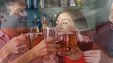 Animation-of-flag-of-chile-over-happy-diverse-friends-toasting-beer-and-wines-at-bar