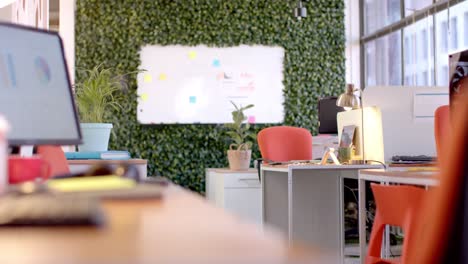 Office-interior-with-green-wall-and-whiteboard,-slow-motion