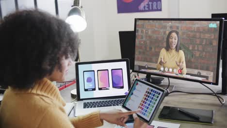 African-american-businesswoman-on-video-call-with-caucasian-female-colleague-on-screen