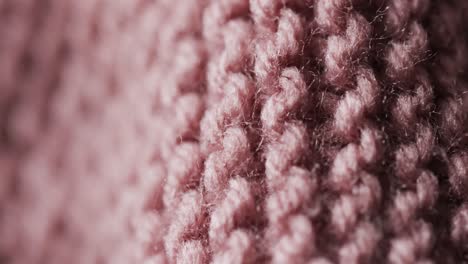 Micro-video-of-close-up-of-pink-wooly-crochet-fabric-with-copy-space