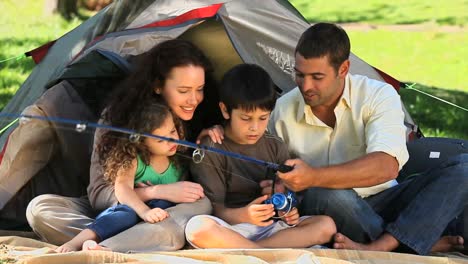 Cute-family-fishing-in-front-of-the-tent