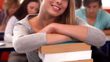 Student-smiling-at-camera-in-class