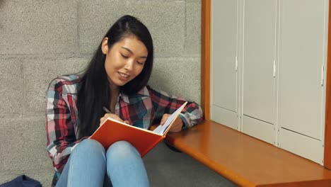 Student-reading-her-school-book