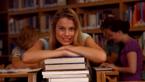 Student-smiling-at-camera-in-library
