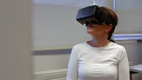 Woman-using-oculus-rift-in-college
