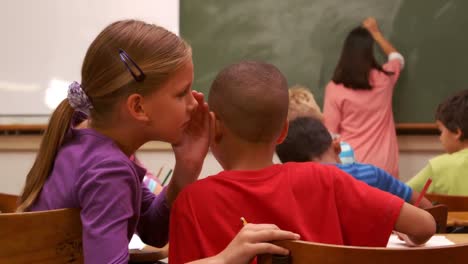 School-children-whispering-during-class