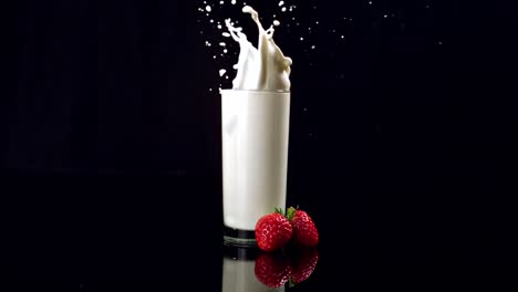 Strawberry-falling-in-glass-of-milk
