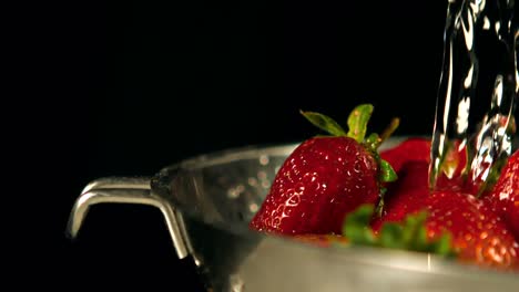 Water-drops-on-strawberries-in-a-sieve