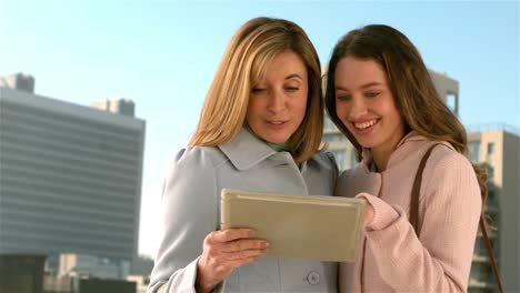 Mother-and-daughter-using-their-tablet