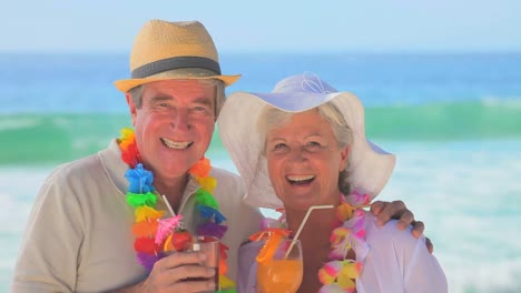 Elderly-couple-wearing-garlands-and-hats