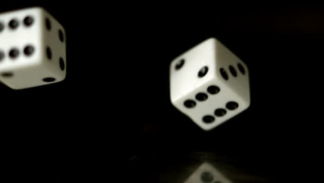 Dice-falling-on-black-background