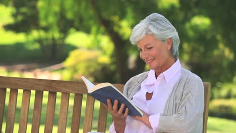 Mature-woman-reading-a-book