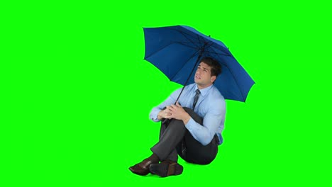 Junger-Geschäftsmann,-Der-Mit-Regenschirm-Schützt