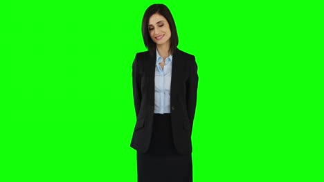 Smiling-businesswoman-pointing-at-screen-