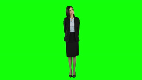 Unsmiling-businesswoman-pointing-at-screen-