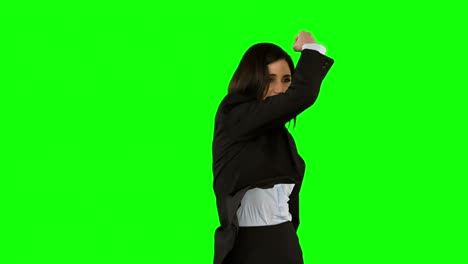 Businesswoman-punching-on-green-screen
