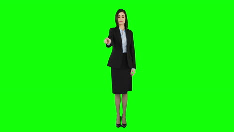 Unsmiling-businesswoman-pointing-at-screen
