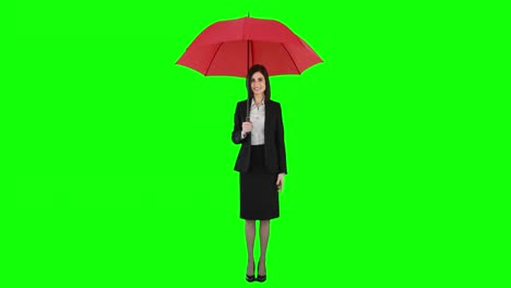 Businesswoman-standing-under-umbrella-