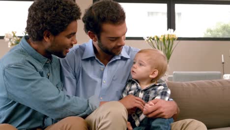 Gay-smiling-couple-with-their-kid