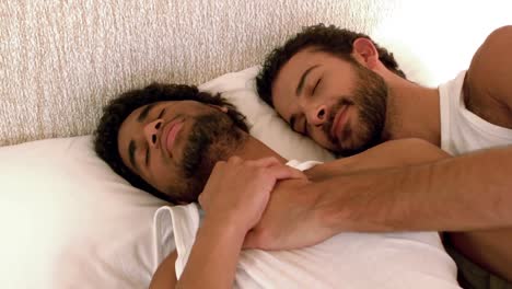Gay-couple-relaxing-in-the-bed