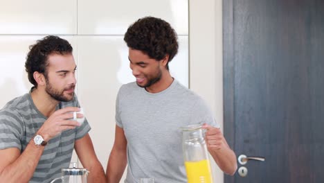 Gay-couple-drinking-in-the-kitchen
