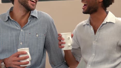 Gay-couple-drinking-cup-of-coffee