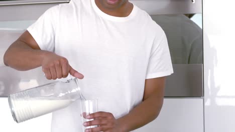 Smiling-man-serving-a-glass-of-water-