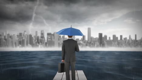 Composite-image-of-businessman-holding-an-umbrella