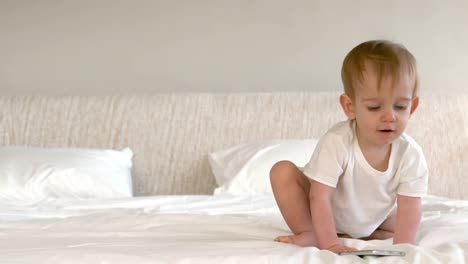 Handsome-little-boy-playing-with-a-smartphone