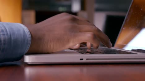 Mans-hands-using-laptop