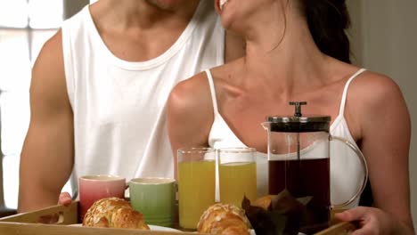 happy-young-couple-taking-breakfast