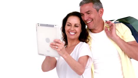 Adult-couple-taking-a-selfie-with-a-tablet